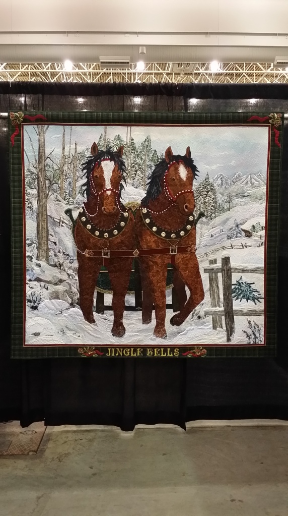 Jingle Bells - 66 x 74; by Kathy McNeil, Tulalip WA.  The threadwork in this quilt is stunning up close; and the quilt feels alive when you stand back 15 feet.
